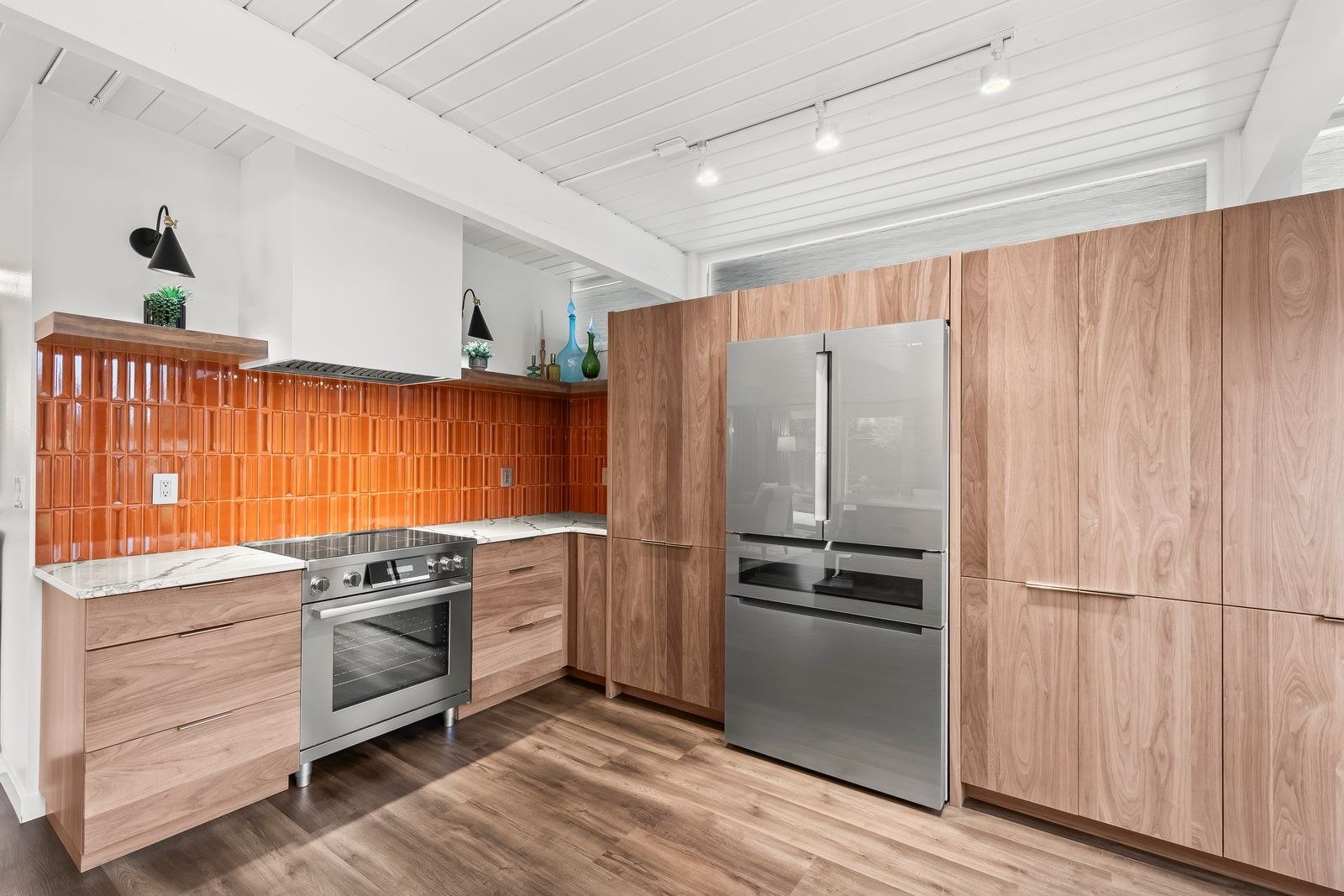 Wyman Drive renovated kitchen with wood cabinetry and orange tile