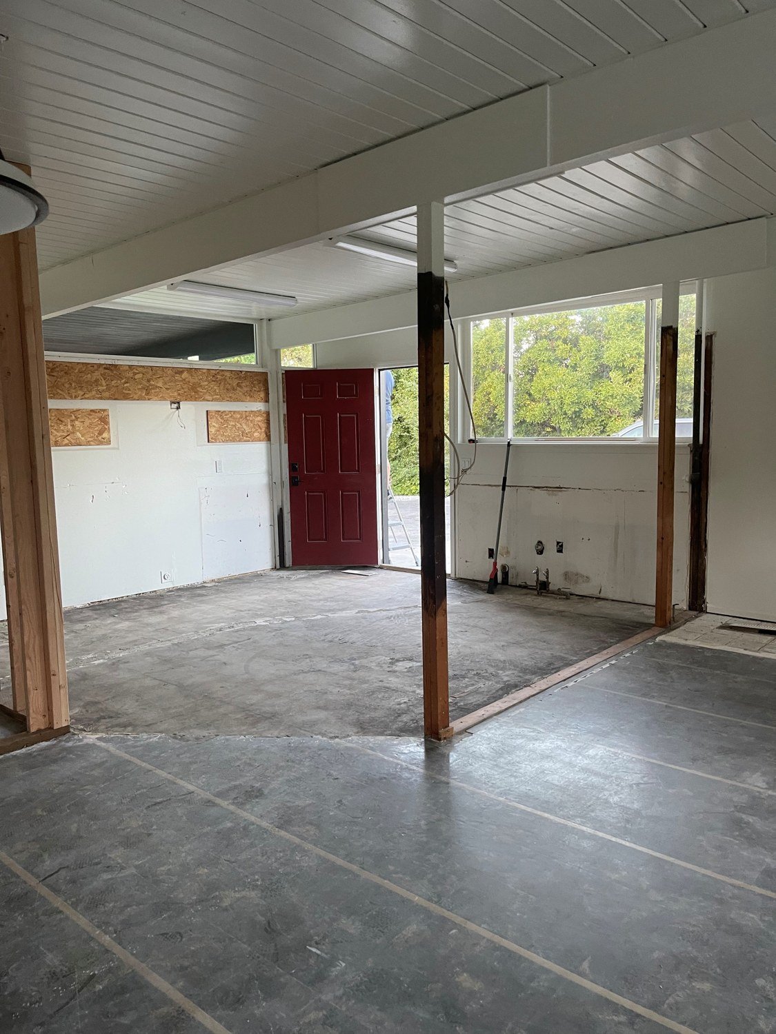 Wyman Drive interior during renovation with exposed subfloor